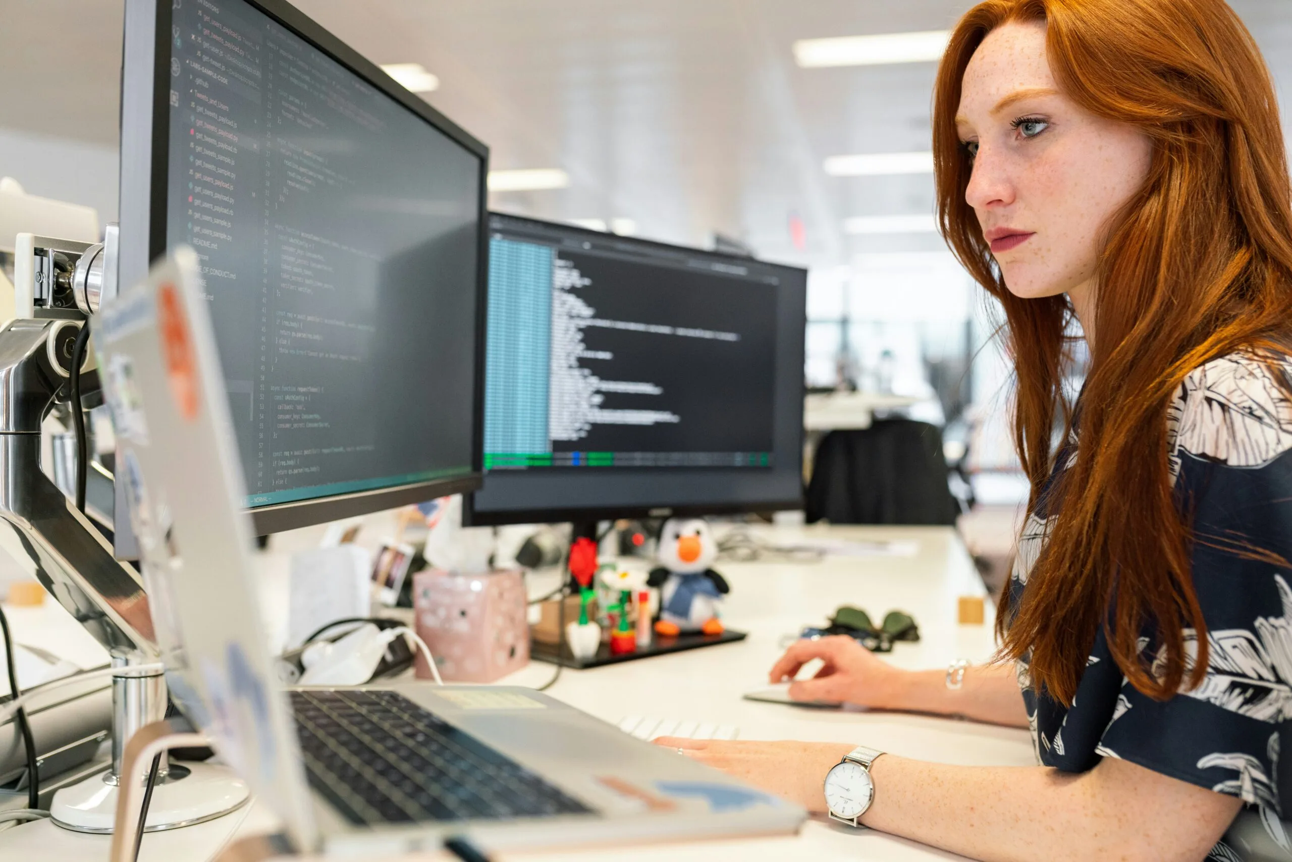 Engineer working across multiple software displays